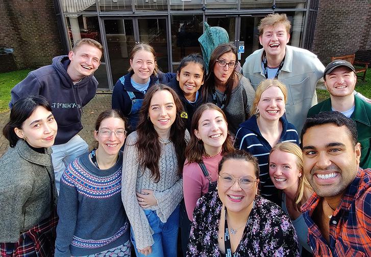 A selfie of the current YAB cohort standing outside. They all smile and look at the camera.