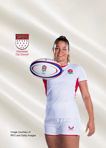 A photo of Jess Breach wearing the England rugby kit; she stands smiling at the camera, holding a rugby ball. The shield of Chichester City Council is at top left.