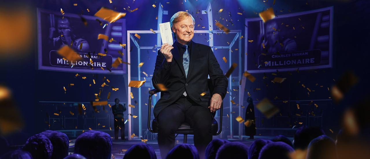 Rory Bremner impersonates Chris Tarrant, triumphantly holding a £1m cheque and surrounded by golden confetti