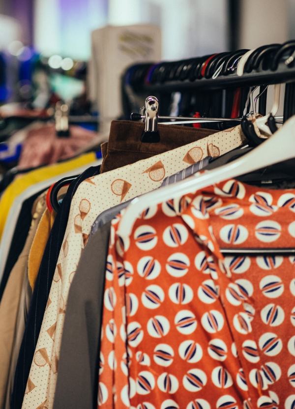 A clothing rail filled with colourful costumes backstage at CFT.