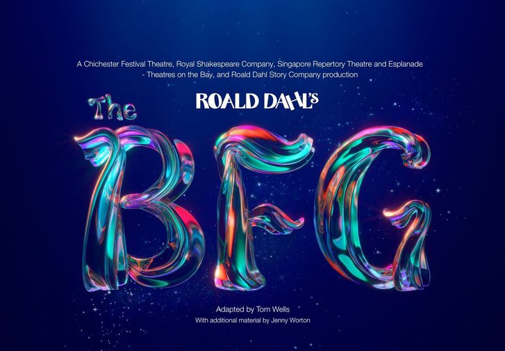Against a dark blue background, text reads 'Roald Dahl's The BFG'. 'Roald Dahl' is in white, with 'The BFG' in a magical, shimmering type with pink, purple, orange and teal glowing and blending throughout. The texture of the text is like a tree trunk or branch.