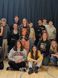 A groups of Chichester College students posing for the camera in the Rehearsal Room.