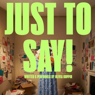 A photo of a person surrounded by hundreds of greetings cards with 'Just To Say!' written over the top in lime green writing.