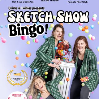 Three performers in green pinstripe jackets laugh as colourful bingo balls fly around them.