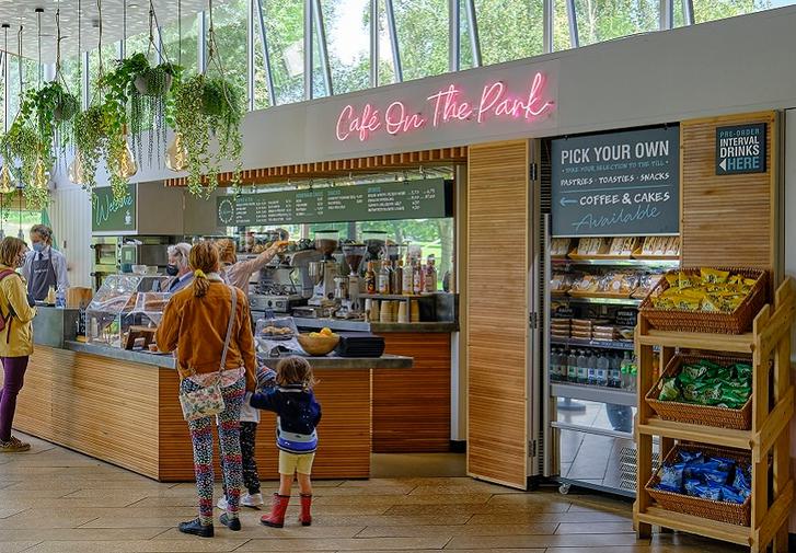 A family are queuing at the Cafe on the Park