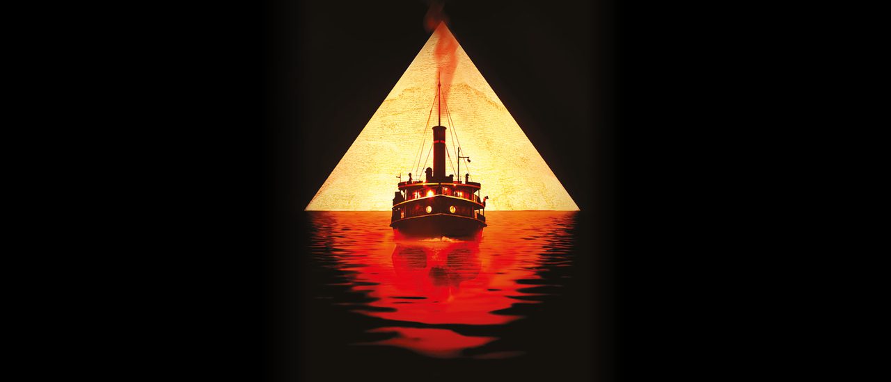 White and gold text on a black background reads 'Agatha Christie's Death on the Nile, adapted for the stage by Ken Ludwig, directed by Lucy Bailey.' In the centre is a graphic depicting a golden triangle with the silhouette of a ship, sailing on red water with the faint outline of a skull hidden within it.