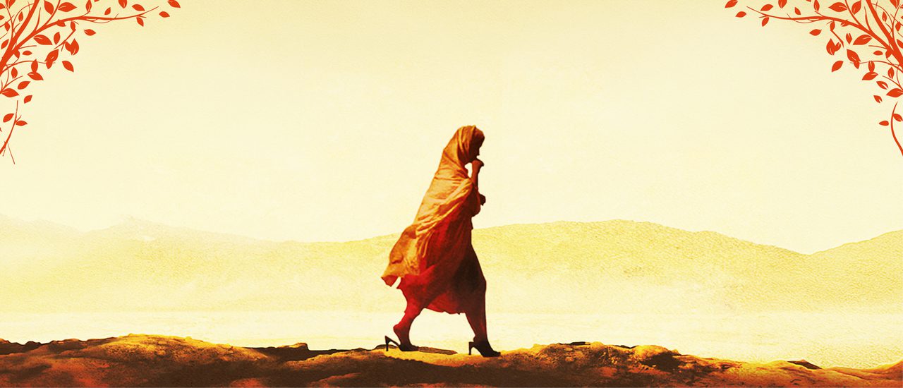 A girl in an orange hijab and abaya walks along rough terrain. The landscape is shades of yellow and mountainous. There are drawing of orange leaves and branches around the edges.