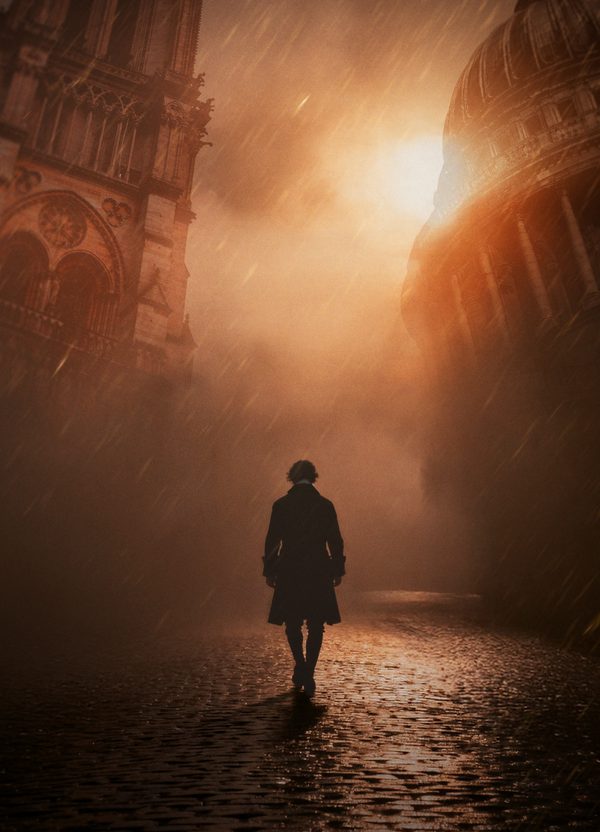 A man in a Victorian frock coat, seen from behind, walks through driving rain across a cobbled street. On either side of him loom one of the towers of Notre Dame, Paris, and St Paul's Cathedral. An orange sun illuminates the atmospheric, ominous scene through the rain.