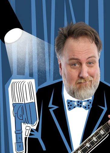A man (Mitch Benn), who has light brown/ grey hair and a thick grey beard and moustache, smiles and plays the guitar. His body is replaced with a cartoon suit and bow tie. The background is also a cartoon illustration with a spotlight, microphone and record cover, all in blue, black and white.
