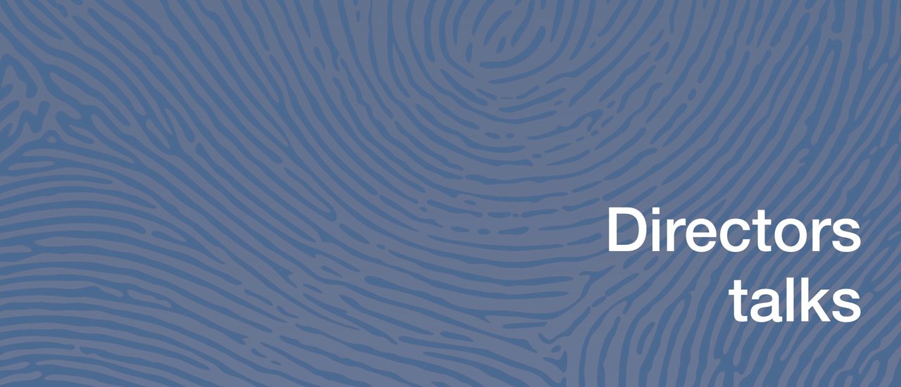 A blue background with a finger print-like pattern, white text reads Directors Talks.