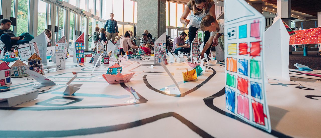 A map of Chichester with 3D drawings from local families stuck onto it.