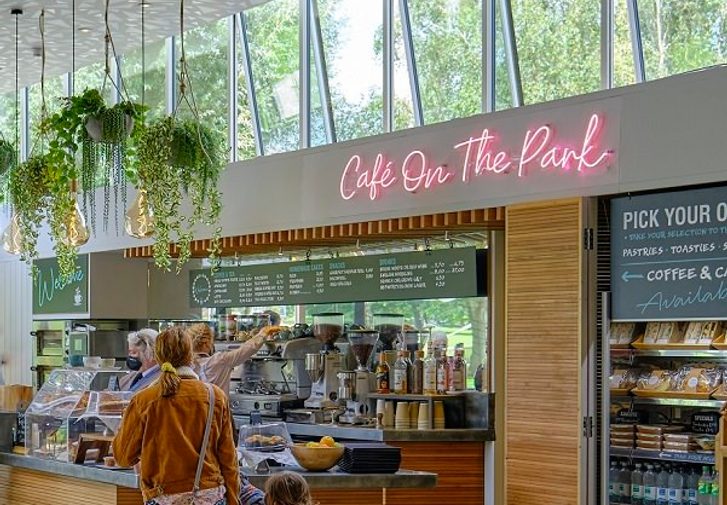 A woman and child are waiting at a cafe