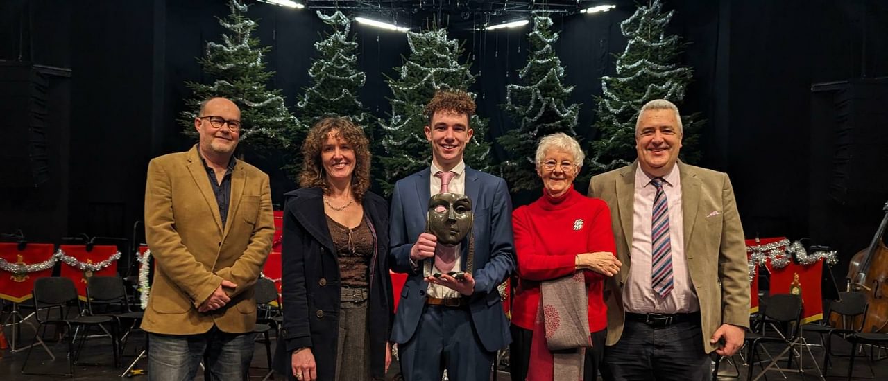 Henry Reeder on the Festival Theatre stage with his family