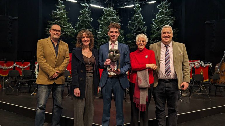 Henry Reeder on the Festival Theatre stage with his family