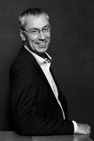 A black and white portrait of Alan Finch