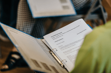 A over shoulder shot of someone reading a script