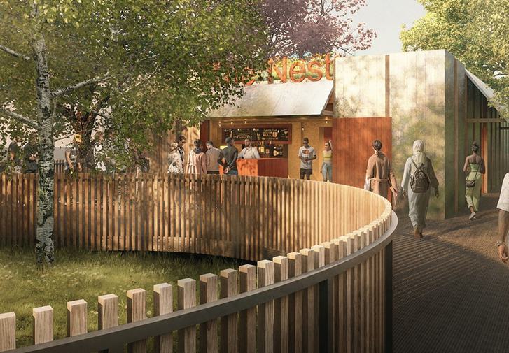 A timber fence panel curves from the left corner to the right and into the distance. There are trees and a building - The Nest - in the distance.