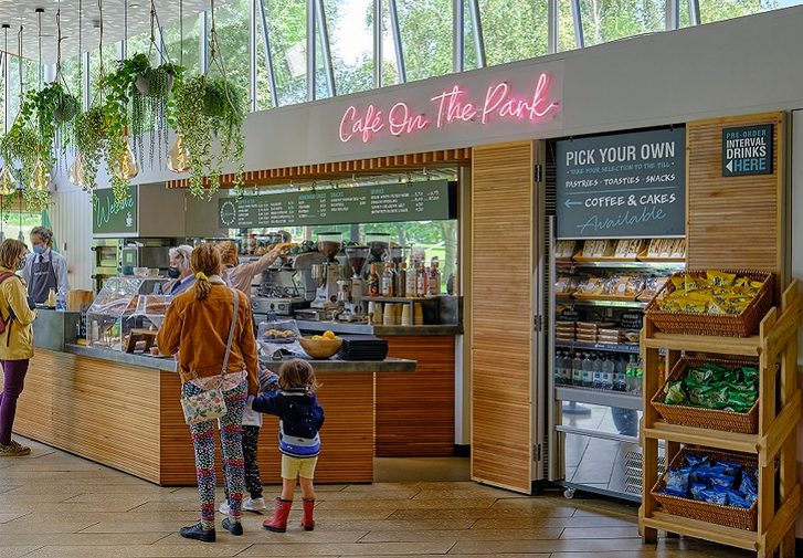 A family are queuing at the Cafe on the Park